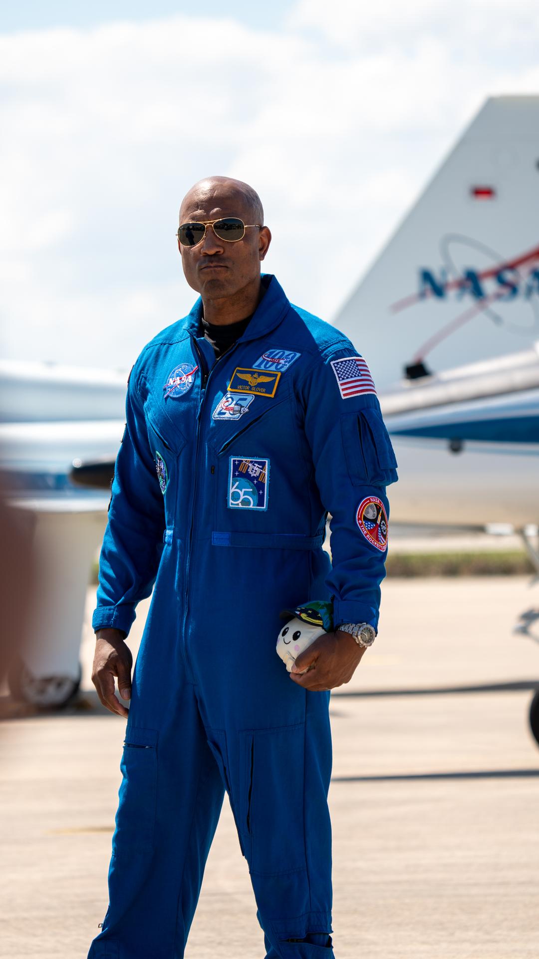 These images show the moments shortly after the arrival of the Artemis II crew to NASA’s Kennedy Space Center on March 27, 2026 ahead of the launch. The four astronauts, Victor Glover, Reid Wiseman, Christina Koch, and Jeremy Hansen, arrived on a T38, which can be seen behind them. They took turns speaking to the crowd as they also announced the zero-gravity indicator they would be taking with them on their journey.   